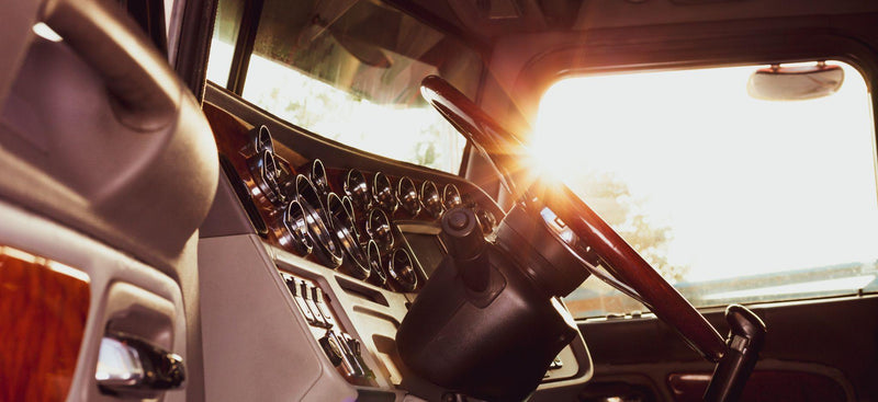 Classic american commercial semi truck with stylish chrome gauges panel