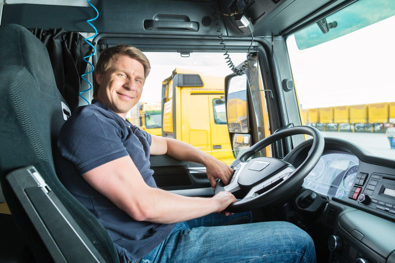 Forwarder or truck driver in drivers cap