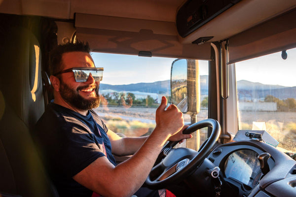 Heavy truck driver happy to be able to drive a truck