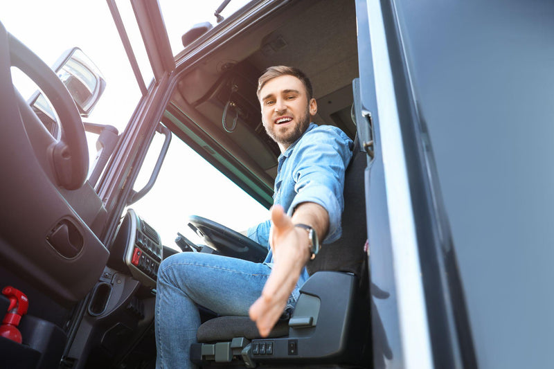 Male driver in cabin of big truck