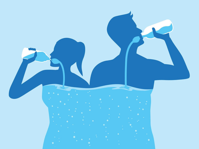 Man and women with water in his body lifting a water bottle and drinking water from bottle flow into body. Healthy lifestyle of people.