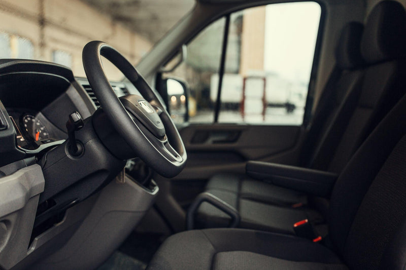 Minivan driver seat inside modern cargo van