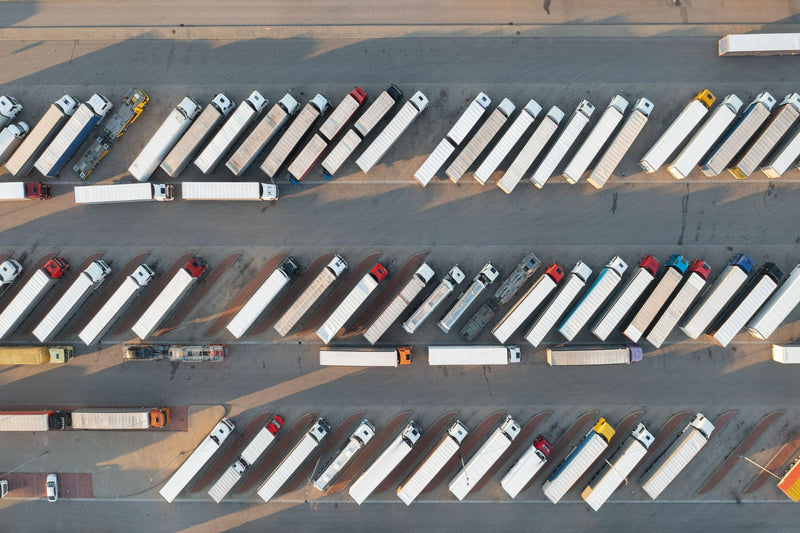 Trucks parked in the parking lot. Directely above.